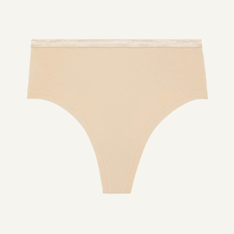 A high rise thong in wheat beige color.
