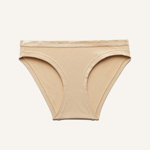 A low rise bikini in wheat beige color.