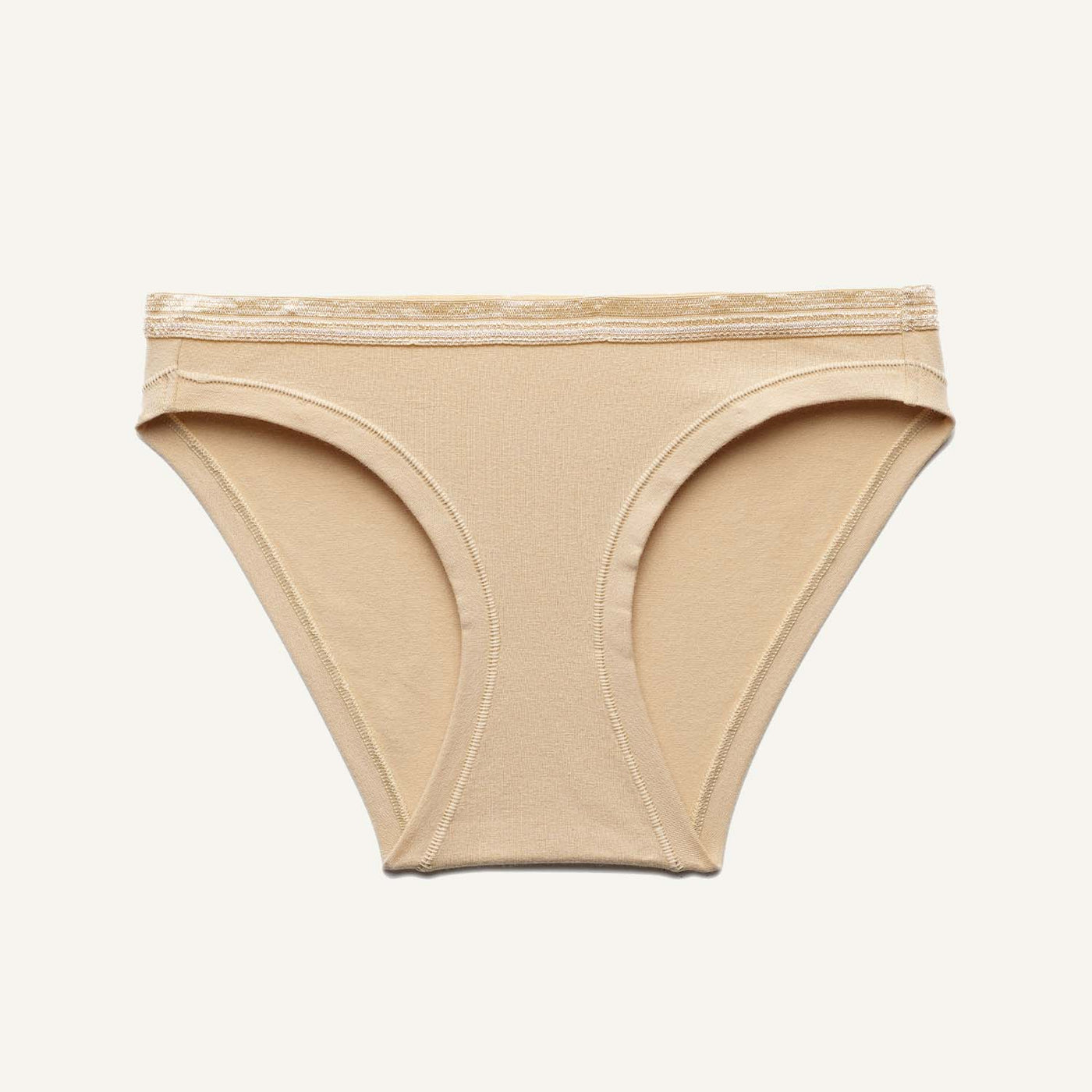 A low rise bikini in wheat beige color.