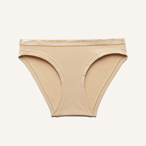 A low rise bikini in wheat beige color.