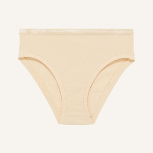 A mid rise bikini in wheat beige color.