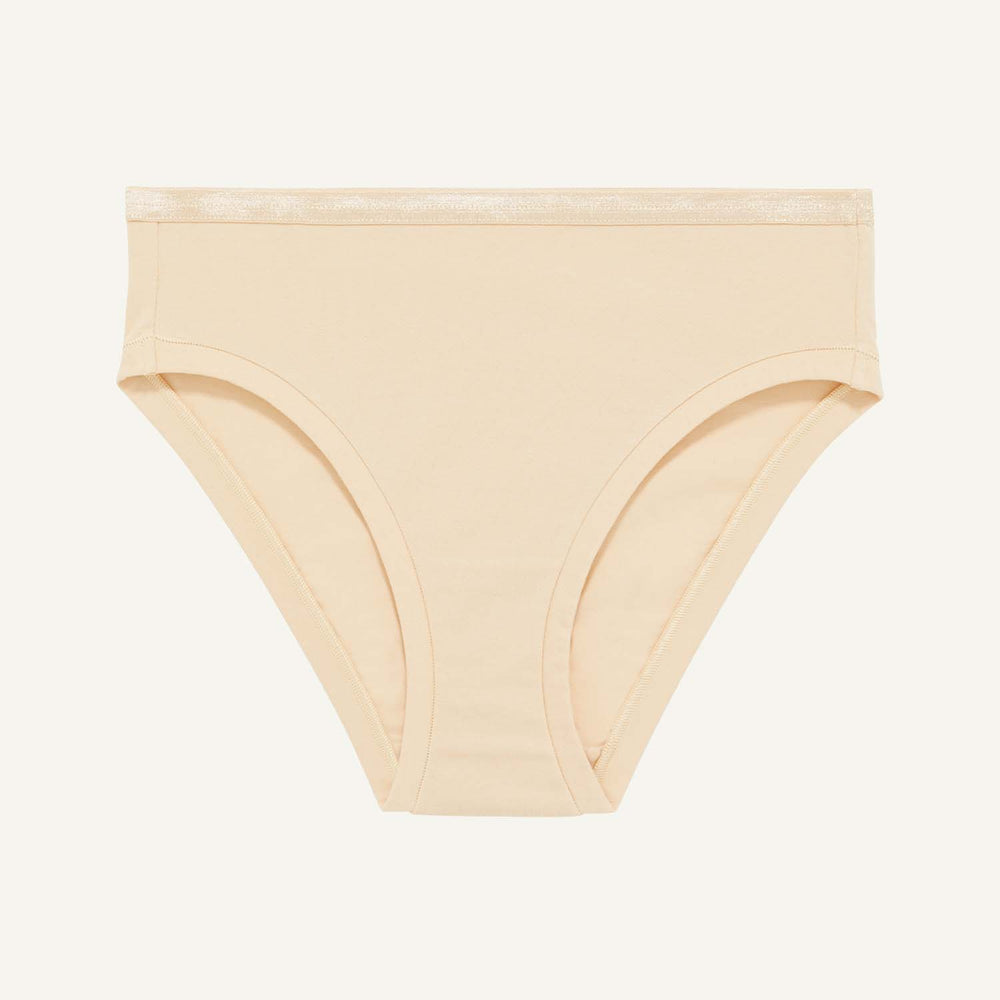 A mid rise bikini in wheat beige color.
