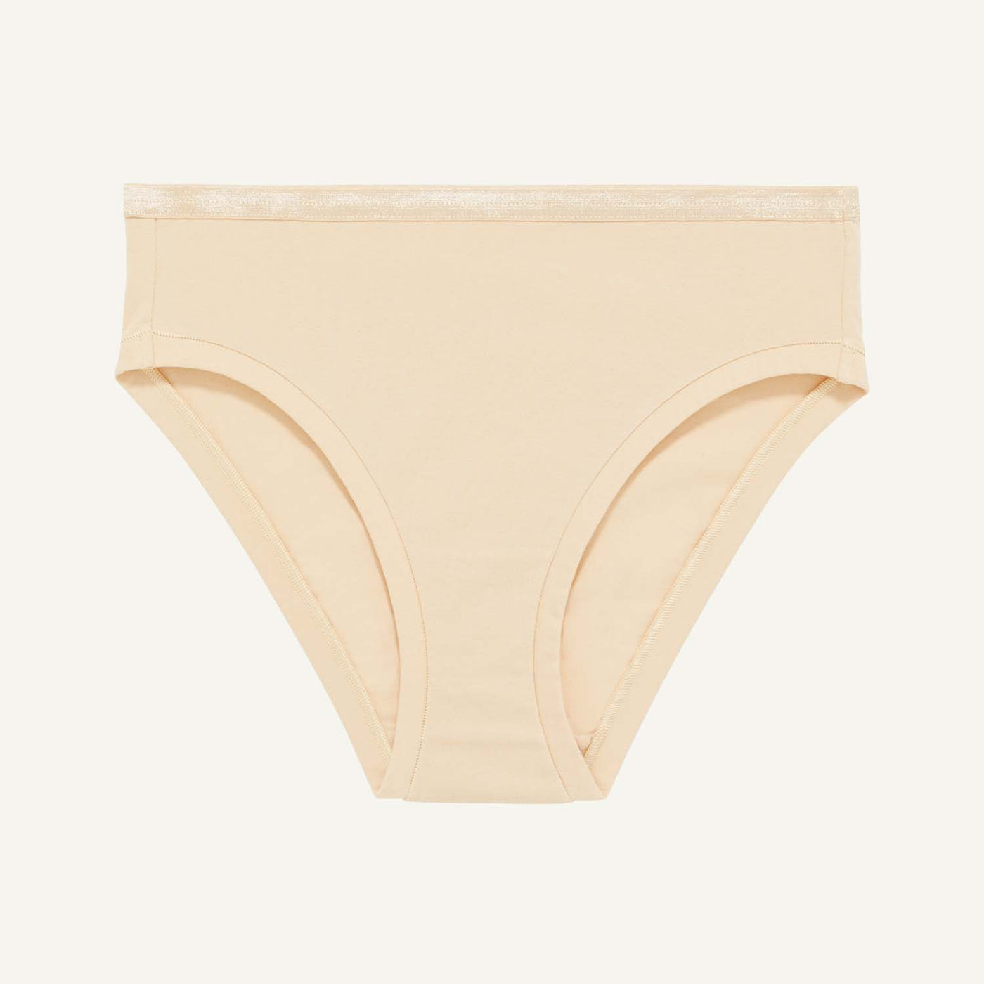A mid rise bikini in wheat beige color.