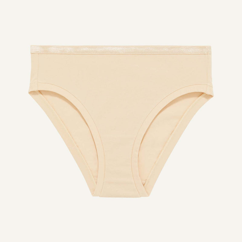 A mid rise bikini in wheat beige color.