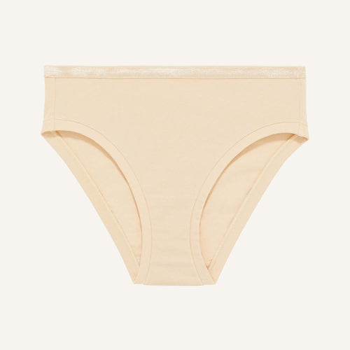 A mid rise bikini in wheat beige color.