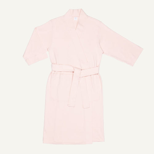 A light pink quartz organic cotton essential robe with 3/4 sleeves and a half-calf length.