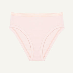 A mid-rise bikini brief in a light pink quartz color made from organic cotton.